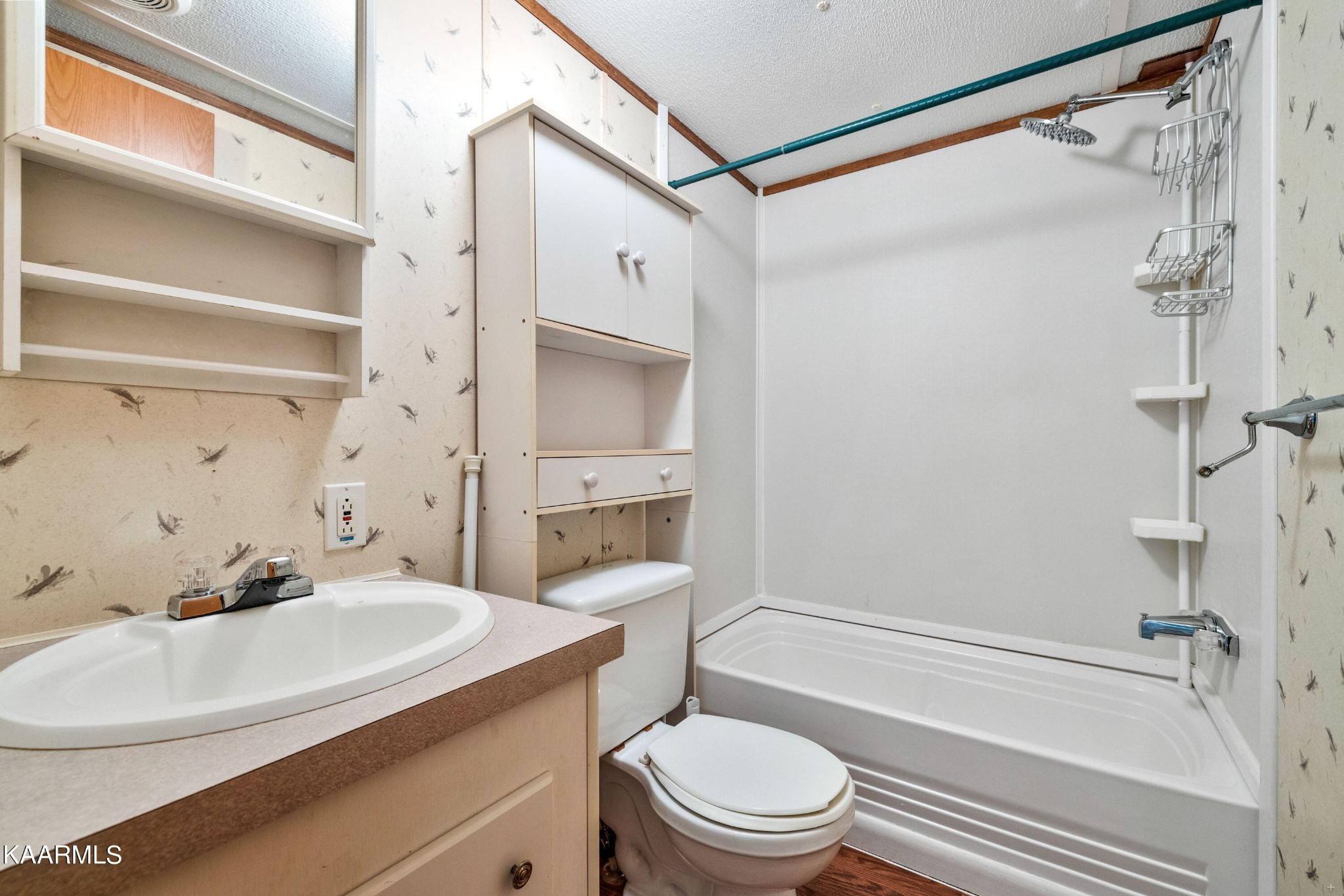 3220 West Wolf Valley Road Clinton, TN 37716 - Photo 10 of 15 a bathroom with a sink toilet and shower