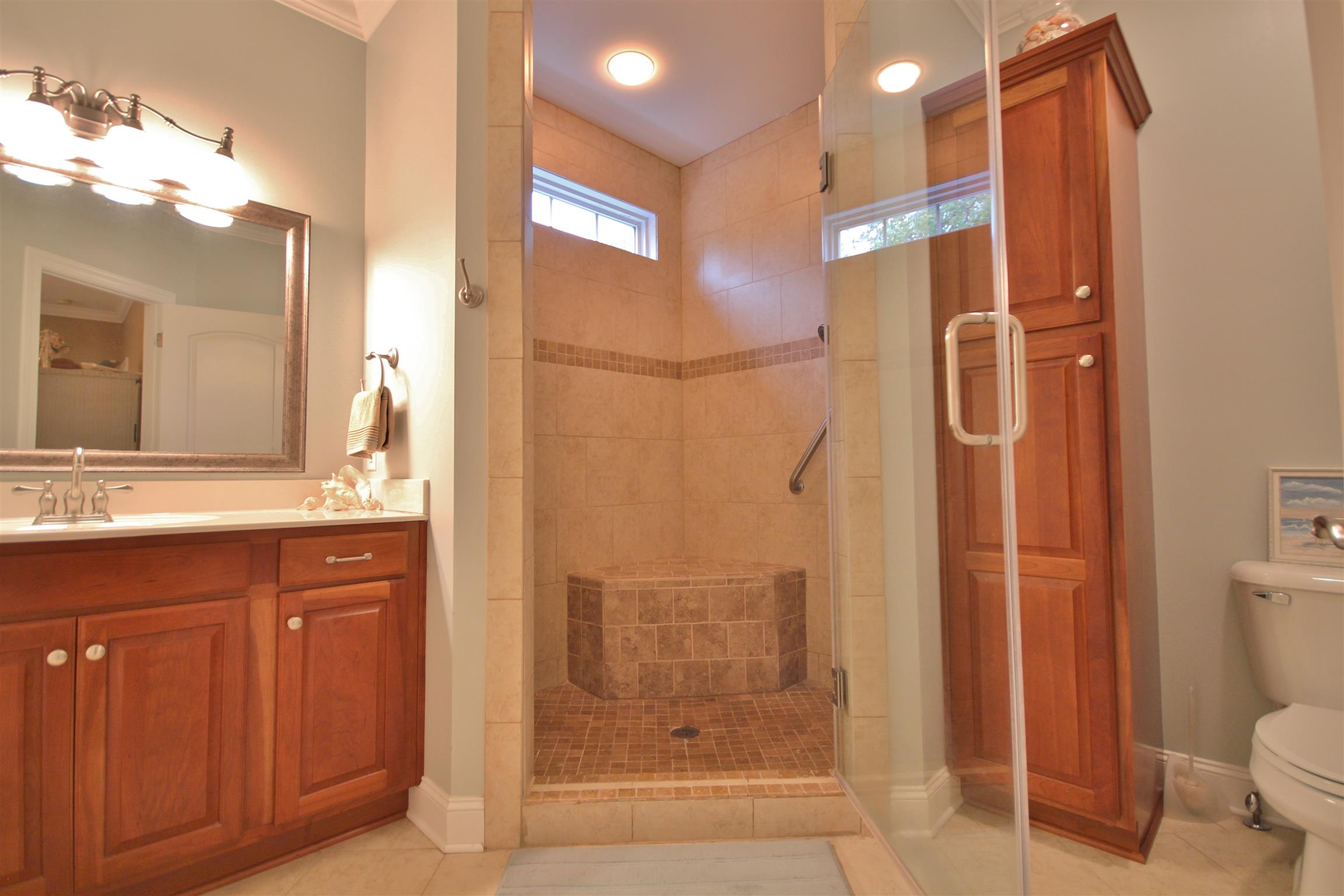 7508 King Road Fairview, TN 37062 - Photo 12 of 30 a bathroom with a shower a sink and a mirror