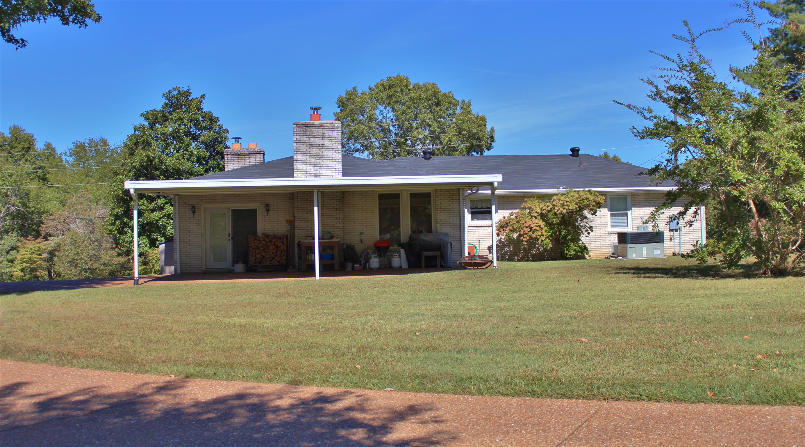 7508 King Road Fairview, TN 37062 - Photo 21 of 30 a front view of a house with a garden