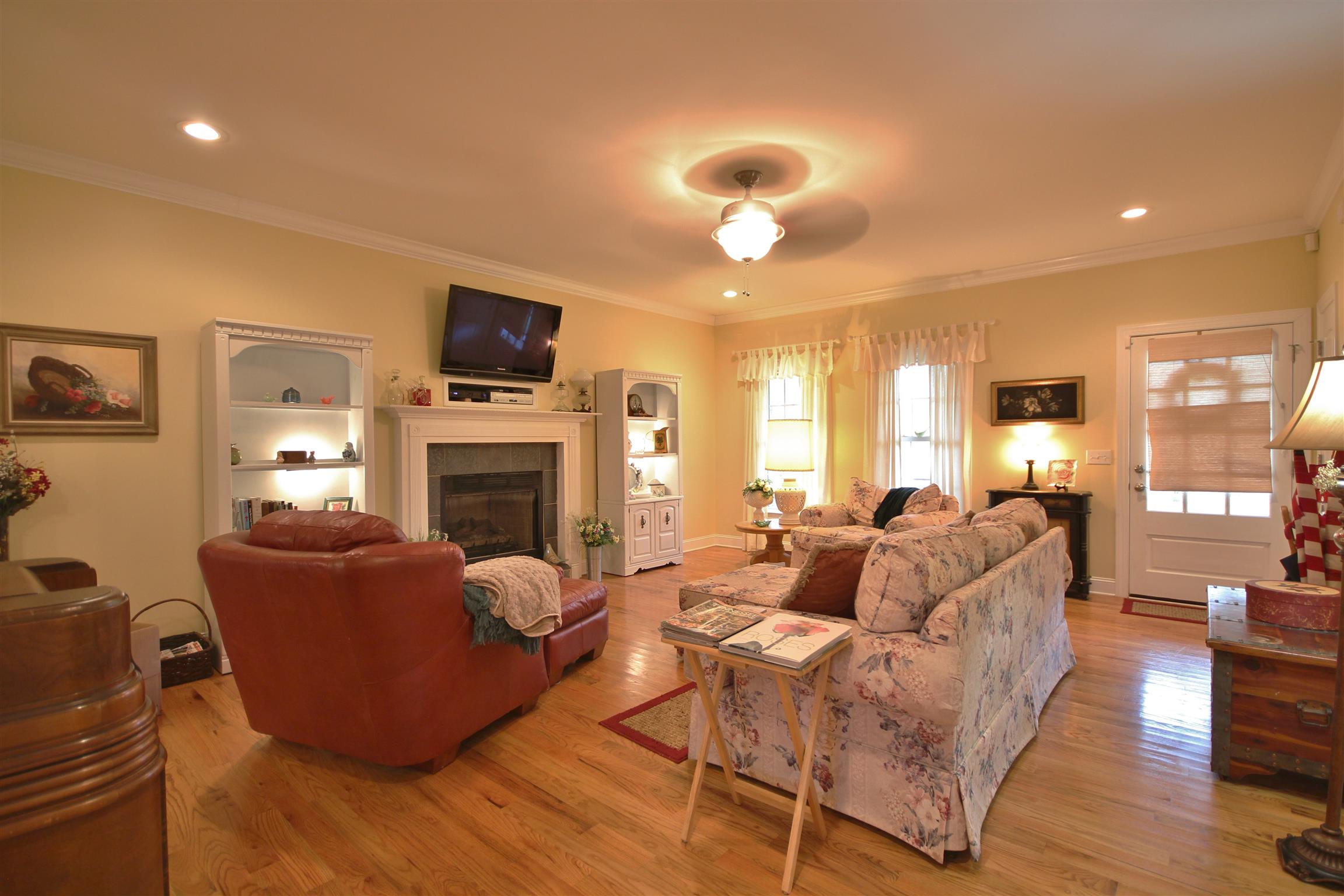 7508 King Road Fairview, TN 37062 - Photo 5 of 30 a living room with furniture a flat screen tv and a fireplace