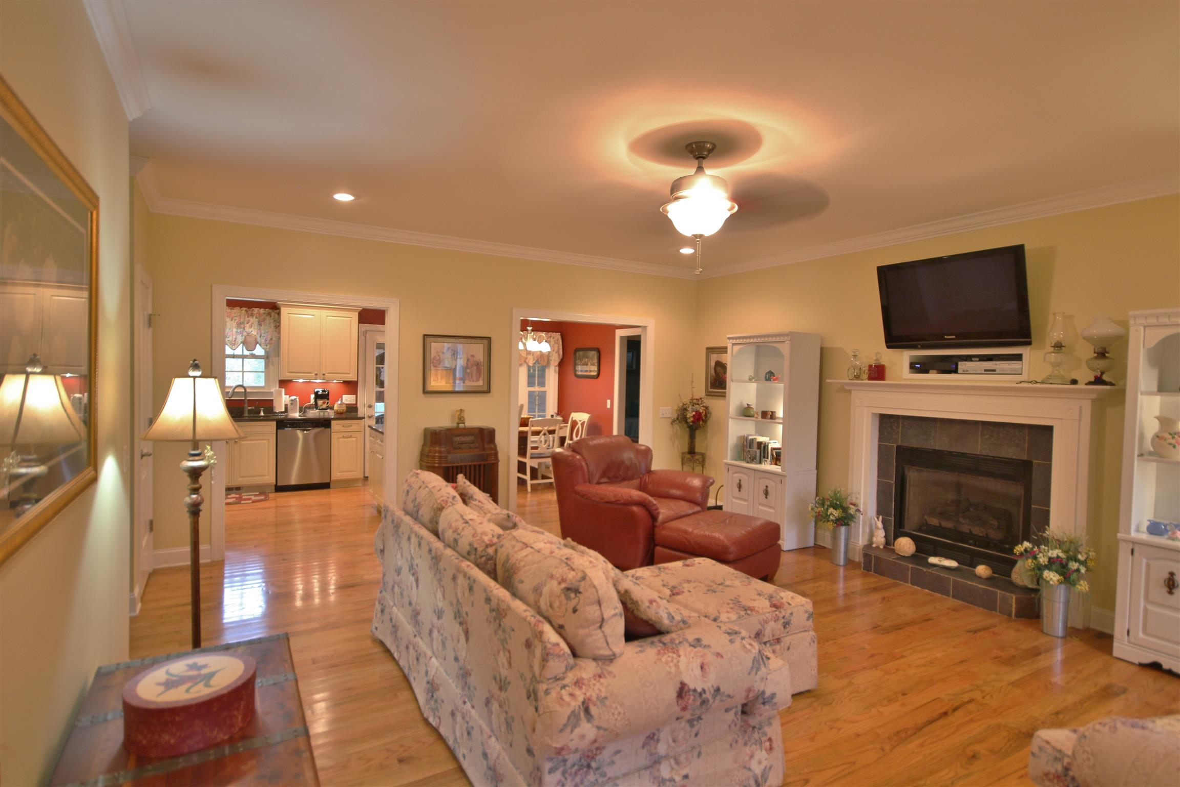 7508 King Road Fairview, TN 37062 - Photo 6 of 30 a living room with furniture a flat screen tv and a fireplace