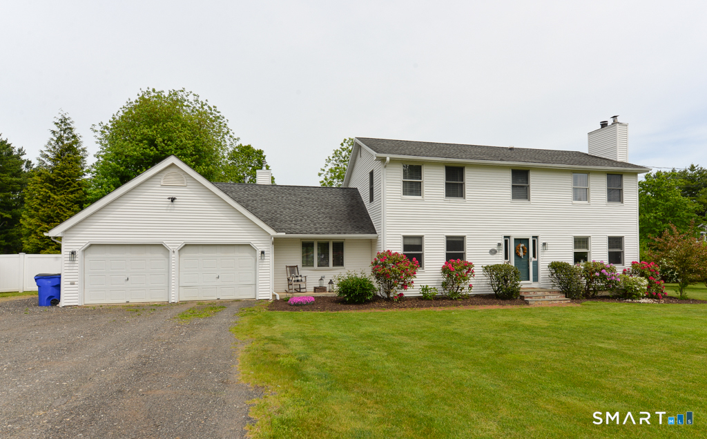 109 Harrison Lane Bethlehem, CT 06751 - Photo 26 of 28 a view of a white house with a yard plants and large tree