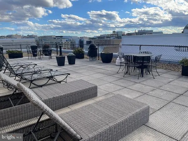 a view of a terrace with furniture