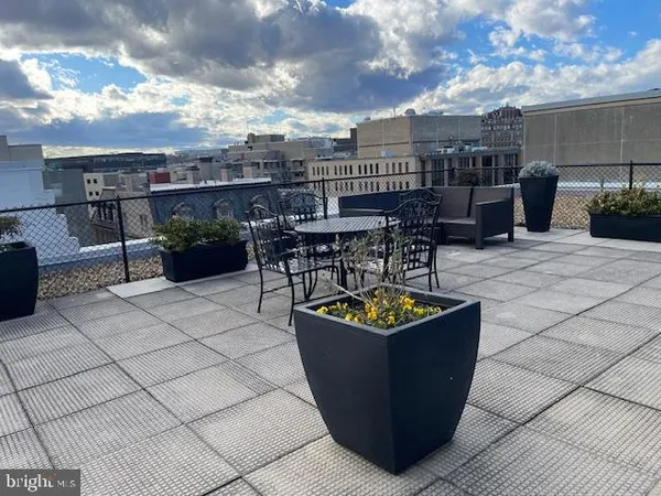 a view of a terrace with furniture