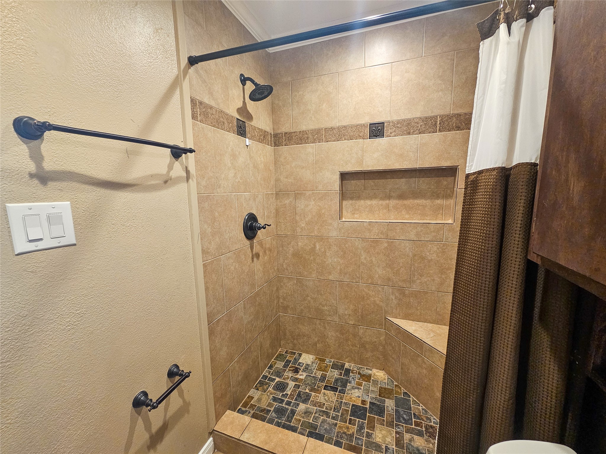 108 Oriole Lane Angleton, TX 77515 - Photo 13 of 20 a bathroom with a shower and a sink