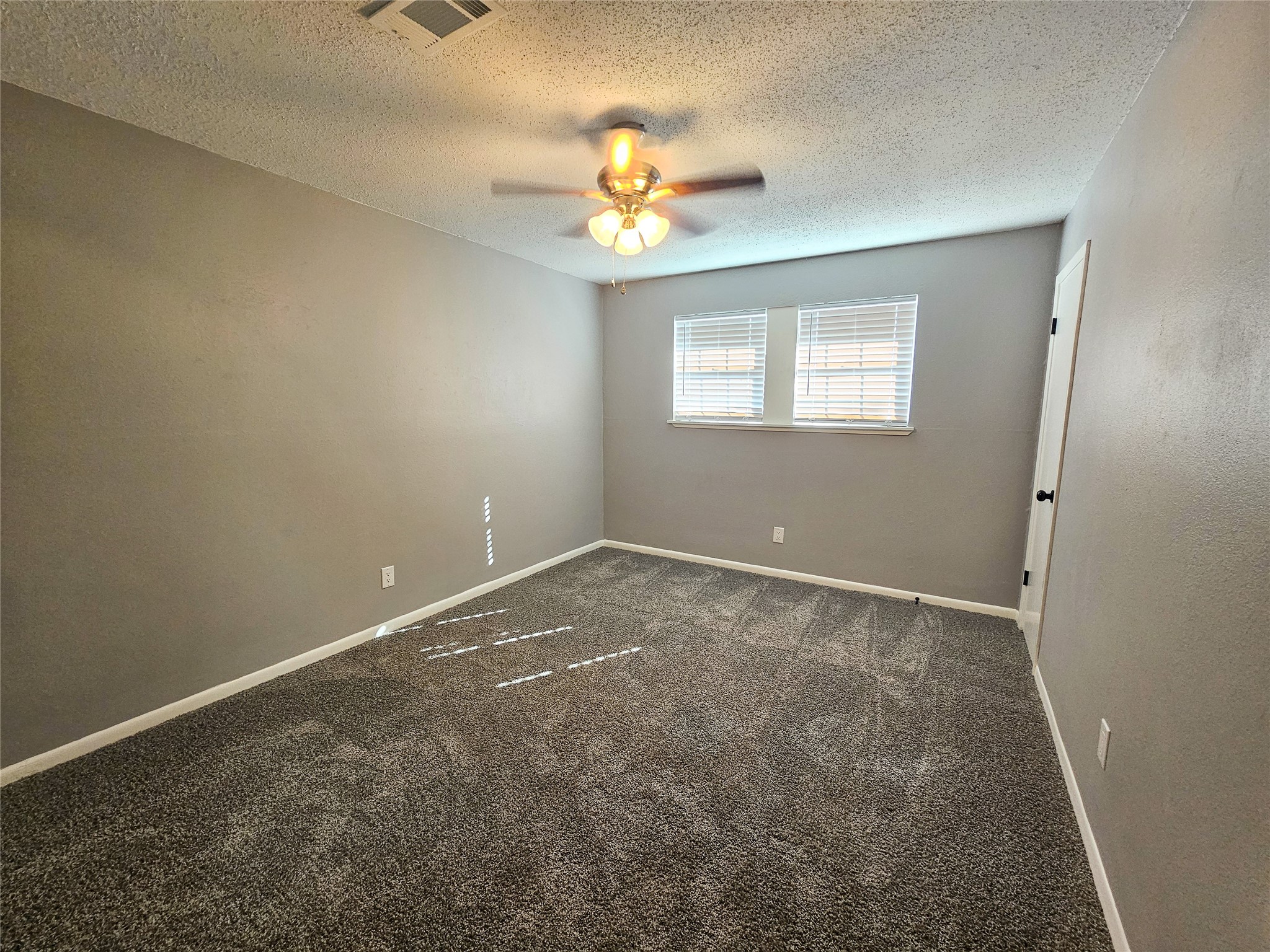 108 Oriole Lane Angleton, TX 77515 - Photo 18 of 20 a view of an empty room with a window