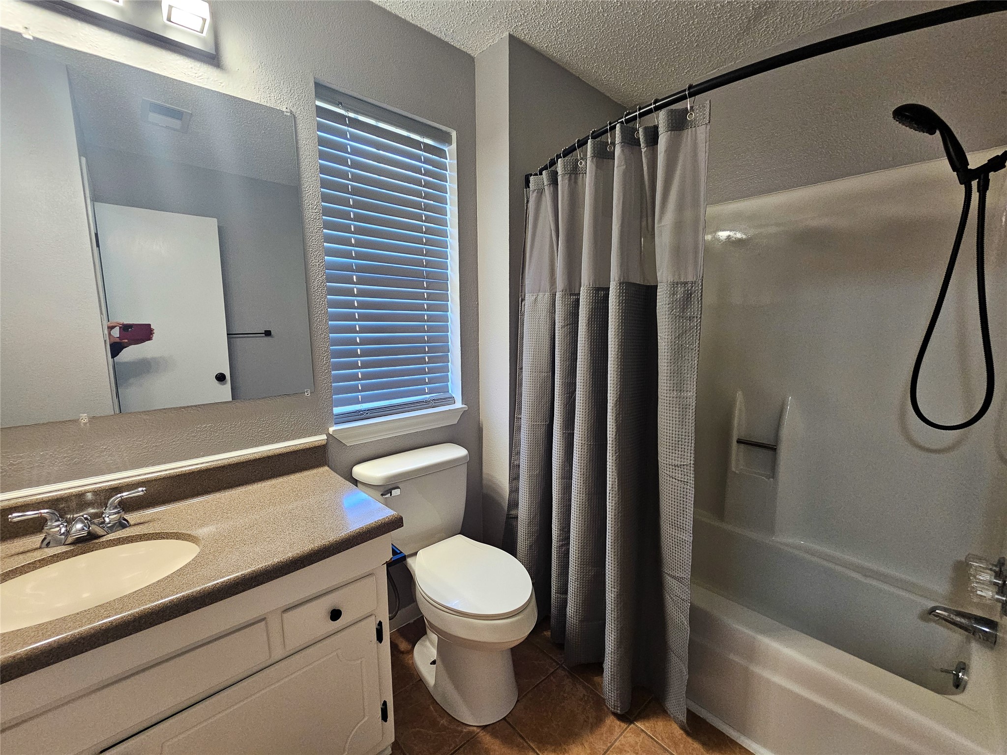 108 Oriole Lane Angleton, TX 77515 - Photo 19 of 20 a bathroom with a granite countertop sink toilet and shower