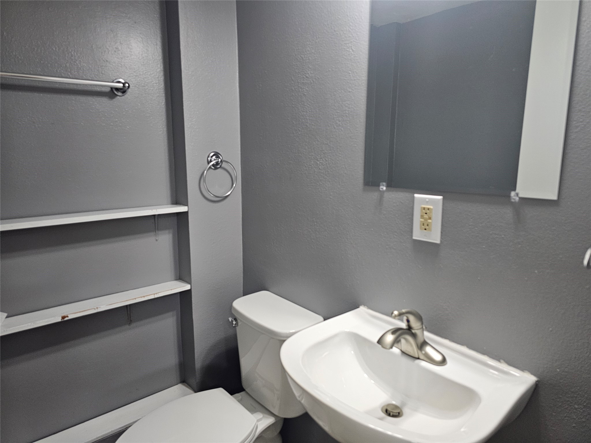 108 Oriole Lane Angleton, TX 77515 - Photo 20 of 20 a bathroom with a sink a toilet and mirror