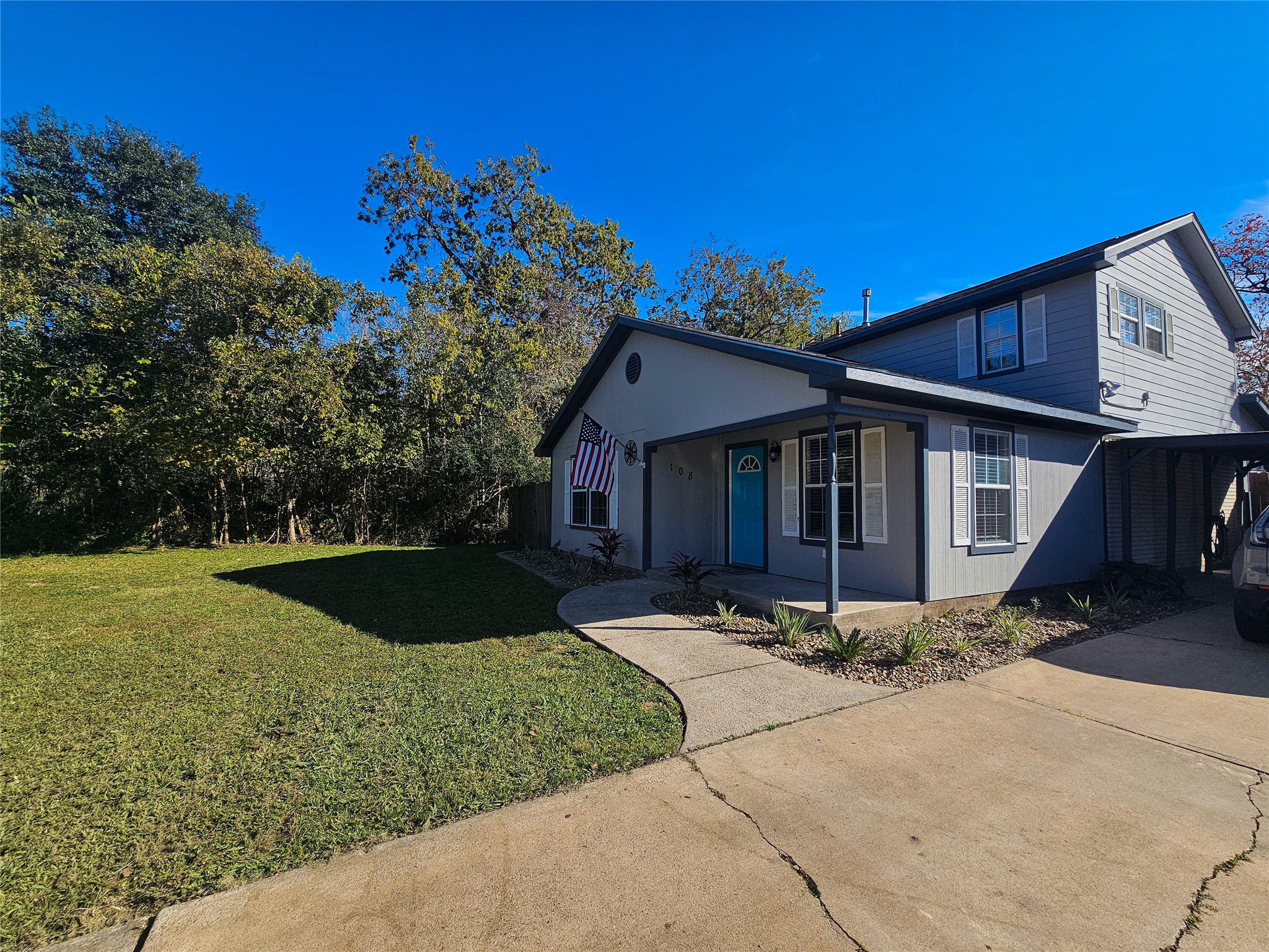 108 Oriole Lane Angleton, TX 77515 - Photo 2 of 20 a front view of a house with garden