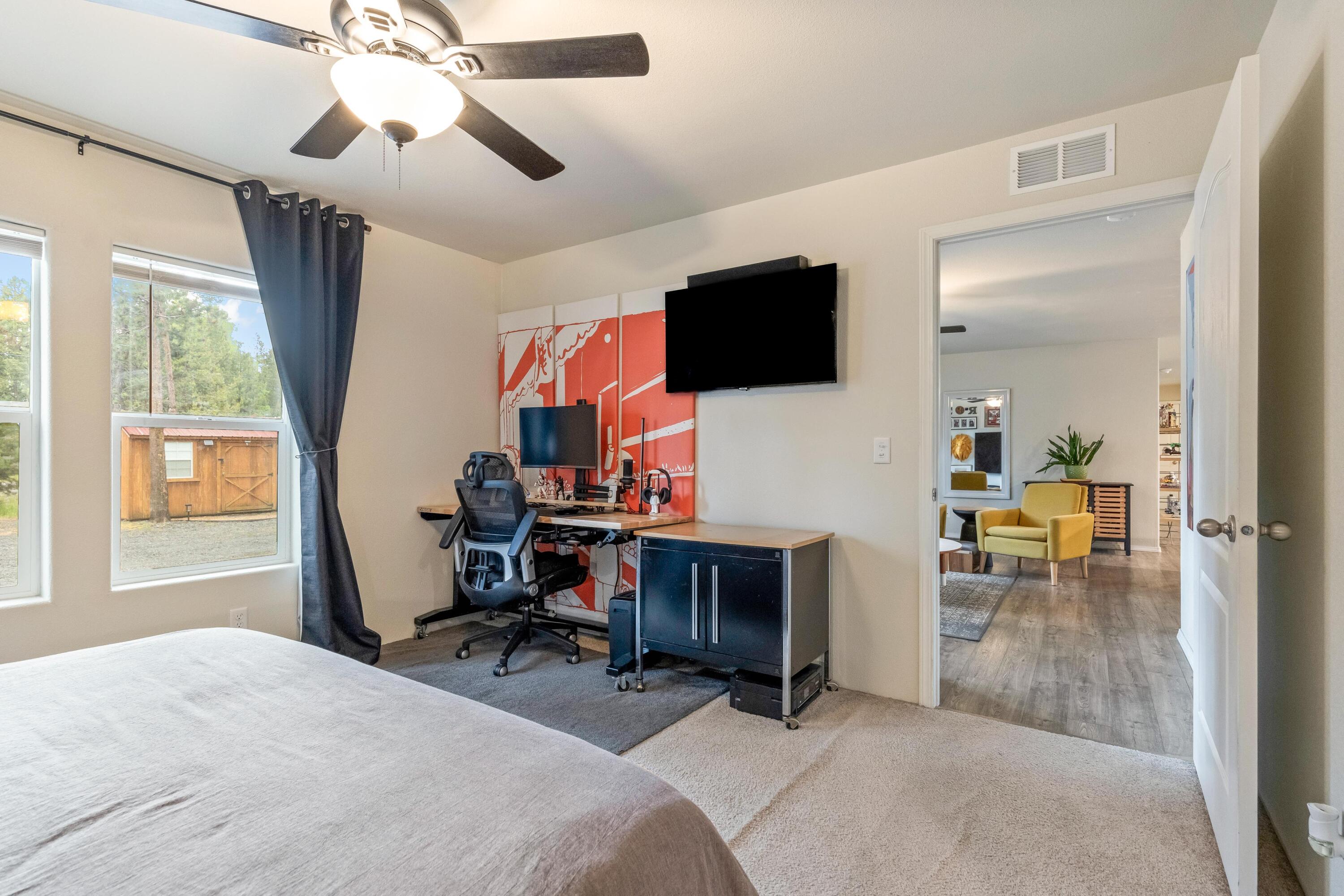 55823 Snow Goose Road Bend, OR 97707 - Photo 14 of 36 a view of a livingroom with workspace and a window
