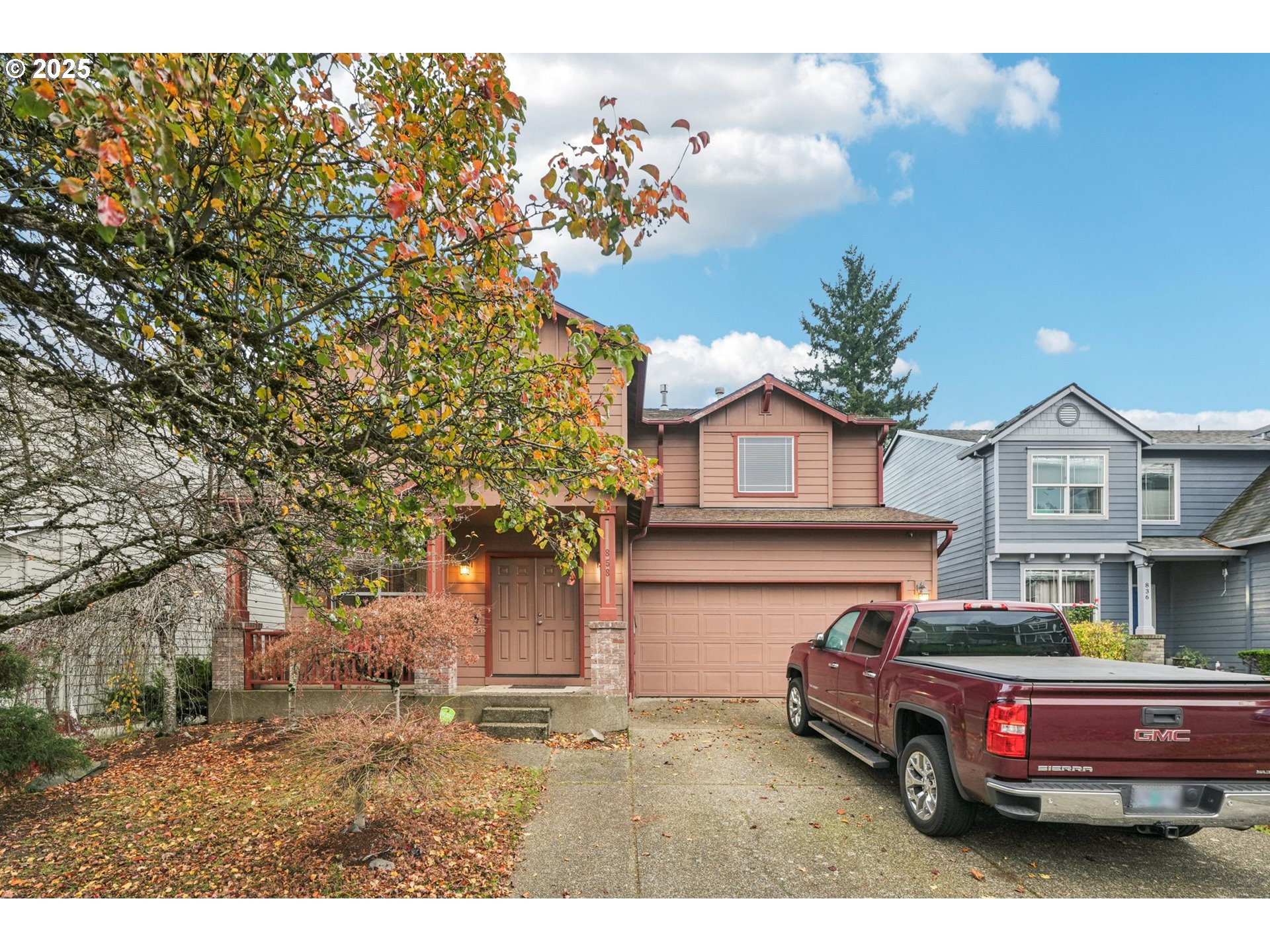 858 Northeast 166th Avenue Portland, OR 97230 - Photo 2 of 17 a car parked in front of a white house