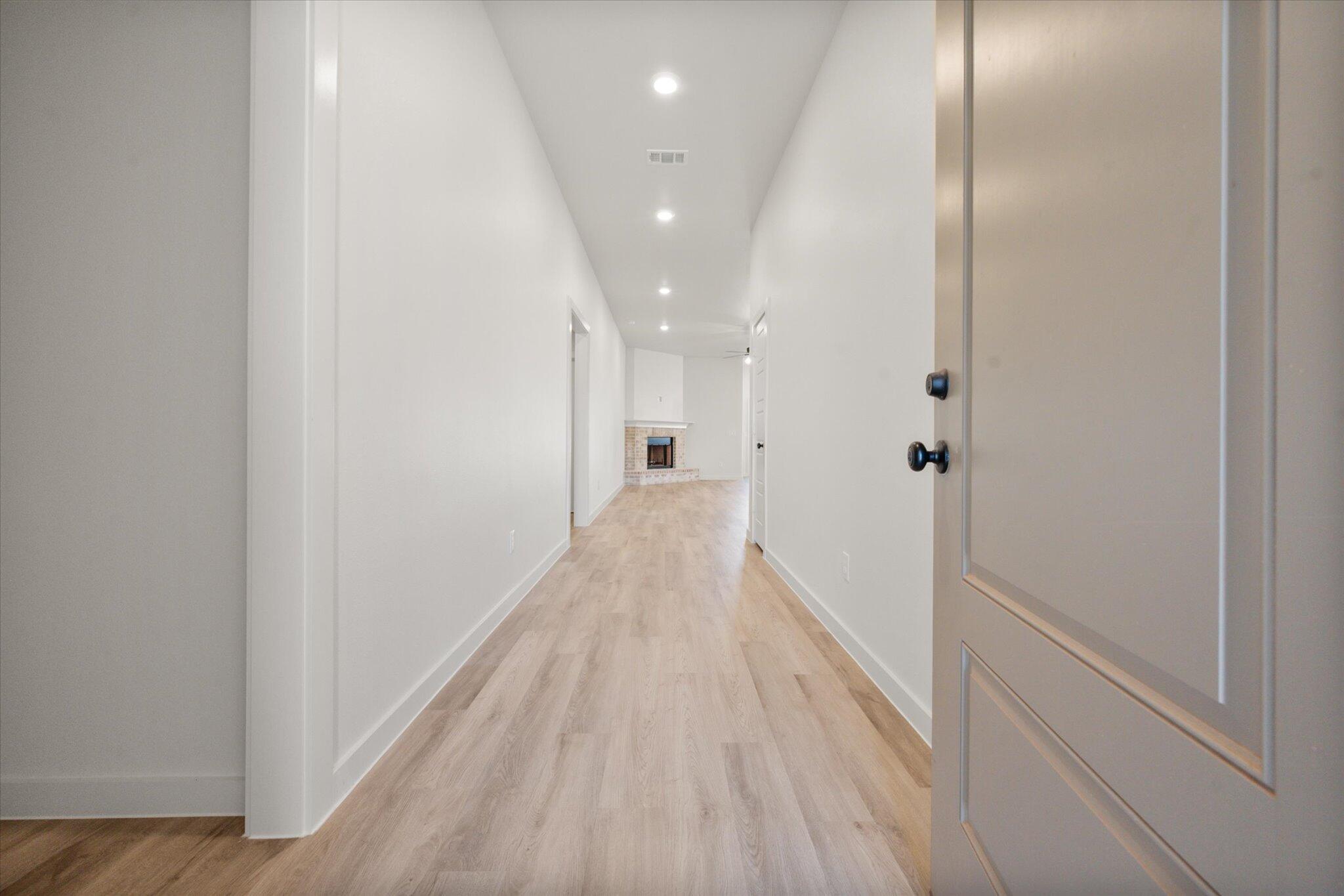 7004 16th Street Lubbock, TX 79416 - Photo 2 of 25 a view of a hallway with wooden floor