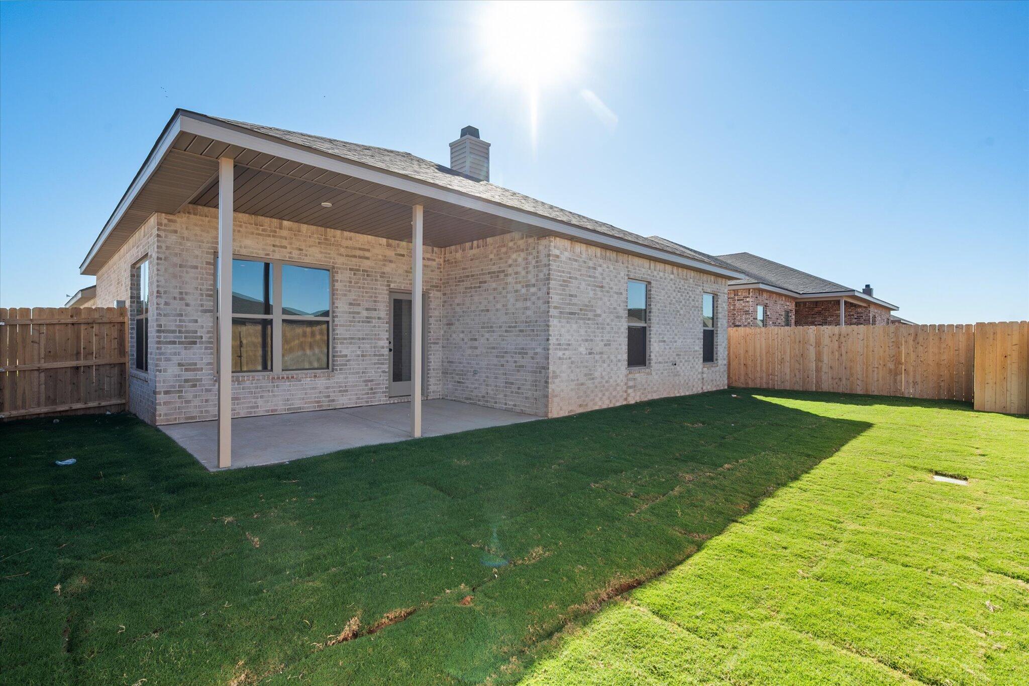7004 16th Street Lubbock, TX 79416 - Photo 24 of 25 a backyard of a house with lots of green space