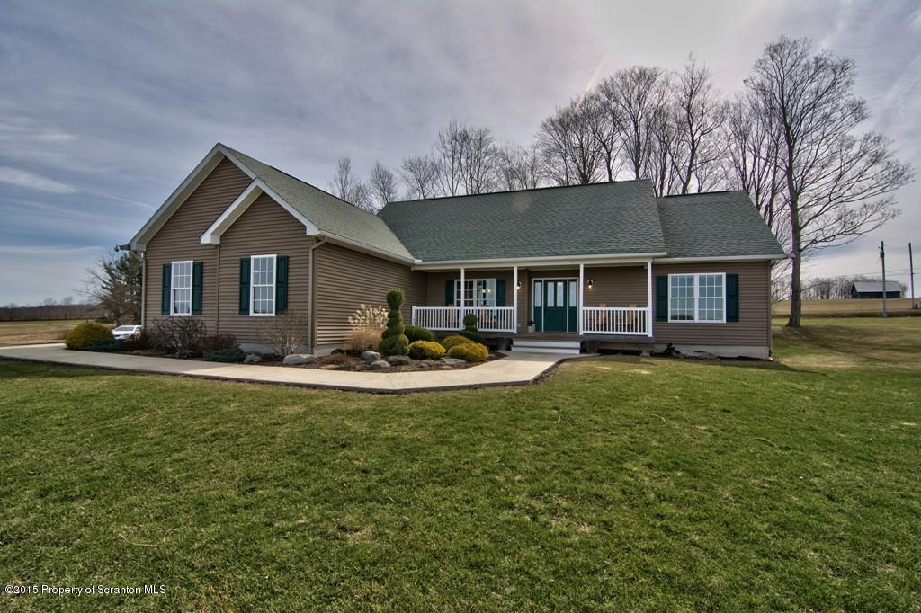 1081 Motichka Road Moscow, PA 18444 - Photo 1 of 90 a front view of a house with swimming pool having outdoor seating