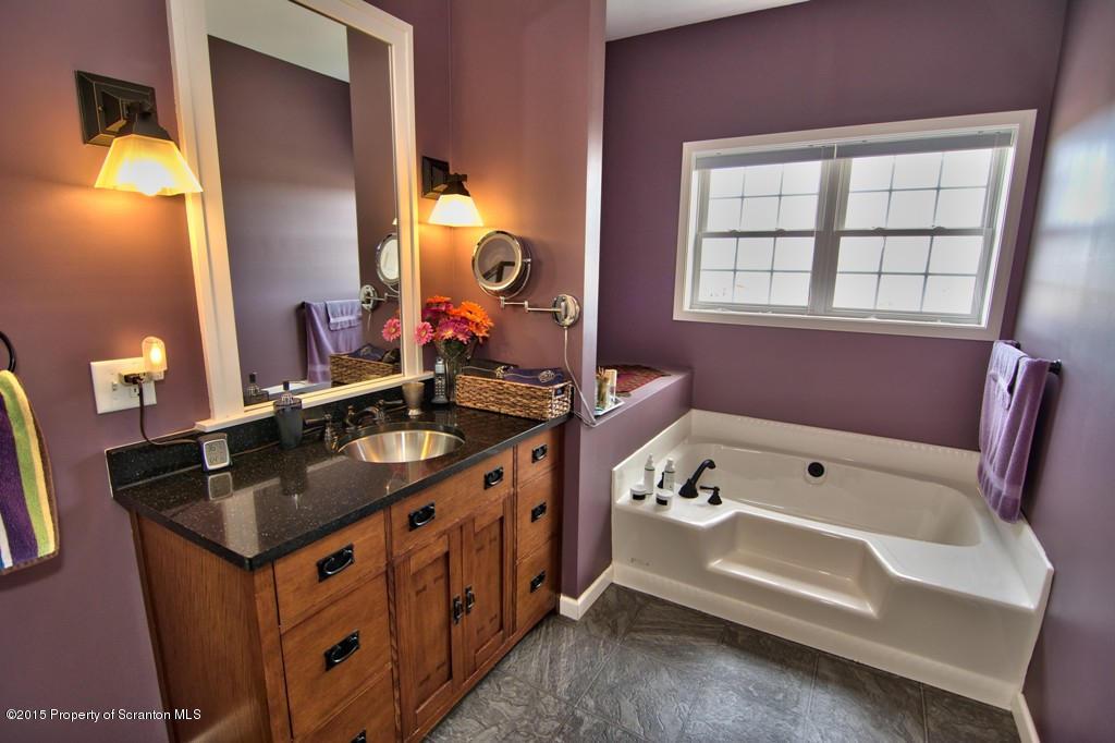 1081 Motichka Road Moscow, PA 18444 - Photo 12 of 90 a bathroom with a sink and a mirror