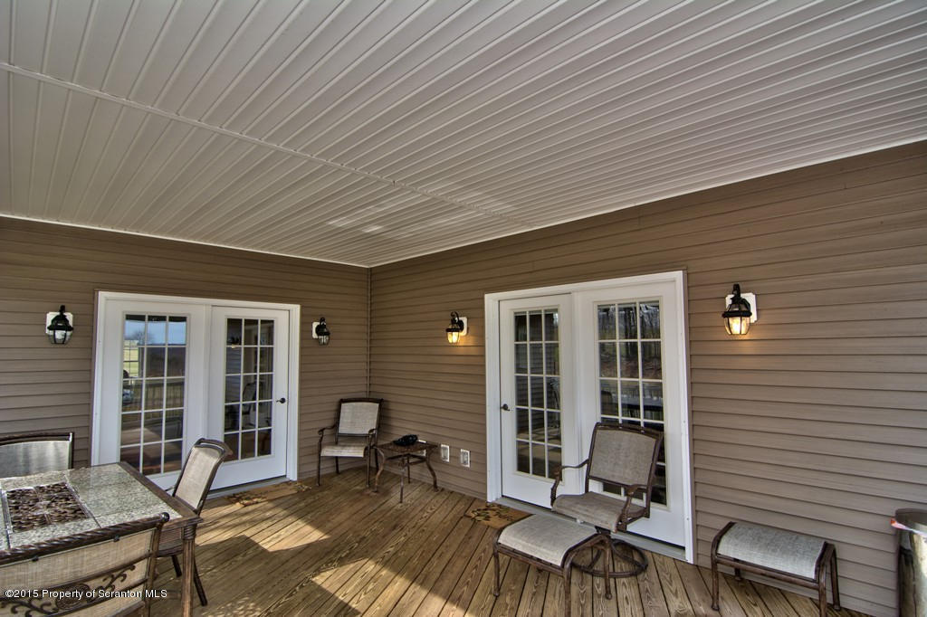 1081 Motichka Road Moscow, PA 18444 - Photo 26 of 90 a view of a patio with table and chairs and potted plants