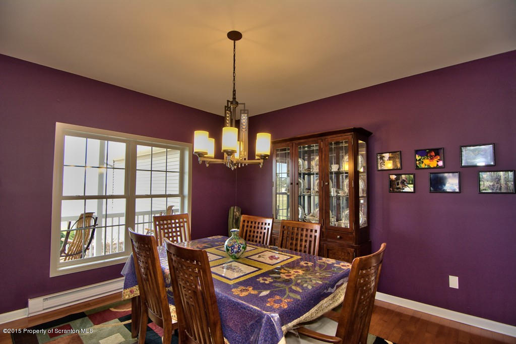 1081 Motichka Road Moscow, PA 18444 - Photo 32 of 90 a view of a dining room with furniture window and wooden floor