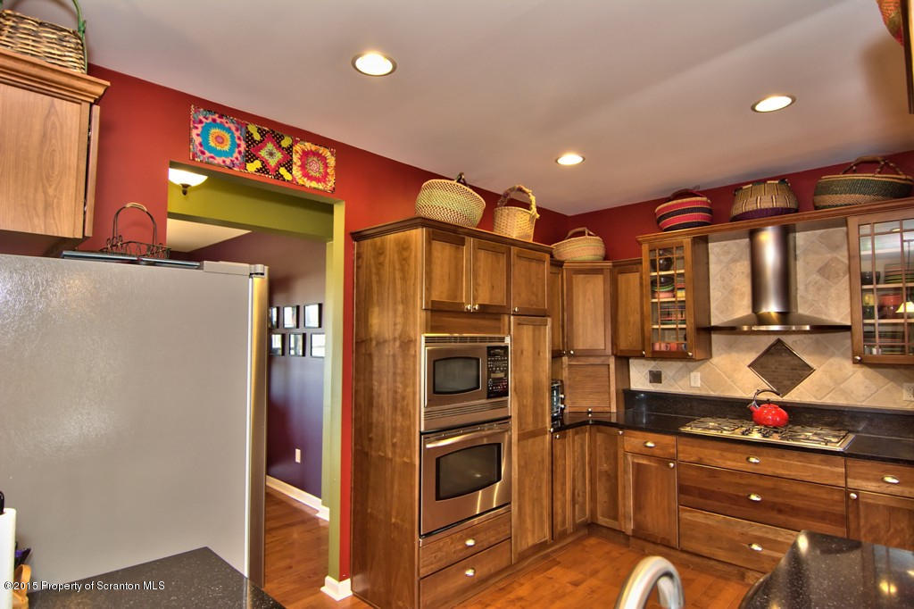 1081 Motichka Road Moscow, PA 18444 - Photo 35 of 90 a kitchen with stainless steel appliances granite countertop a refrigerator and a sink