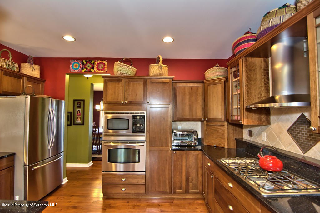 1081 Motichka Road Moscow, PA 18444 - Photo 36 of 90 a kitchen with stainless steel appliances granite countertop a refrigerator and a stove