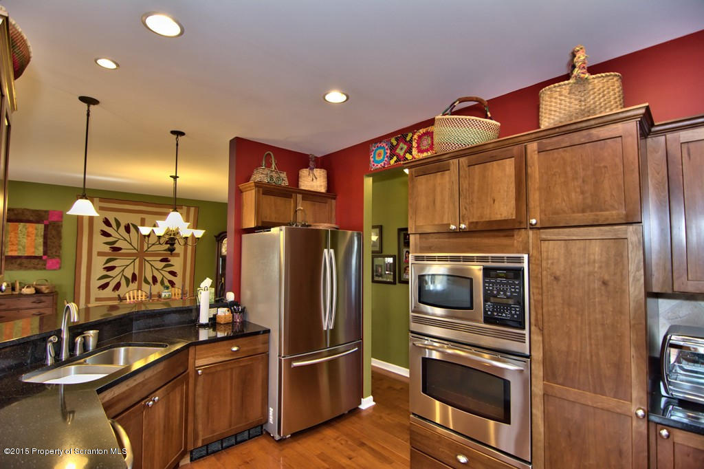 1081 Motichka Road Moscow, PA 18444 - Photo 37 of 90 a kitchen with stainless steel appliances a refrigerator and a stove