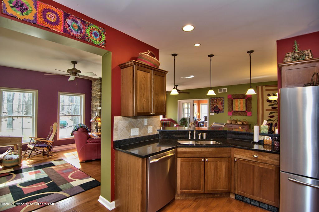 1081 Motichka Road Moscow, PA 18444 - Photo 38 of 90 a kitchen with counter top space a sink and refrigerator