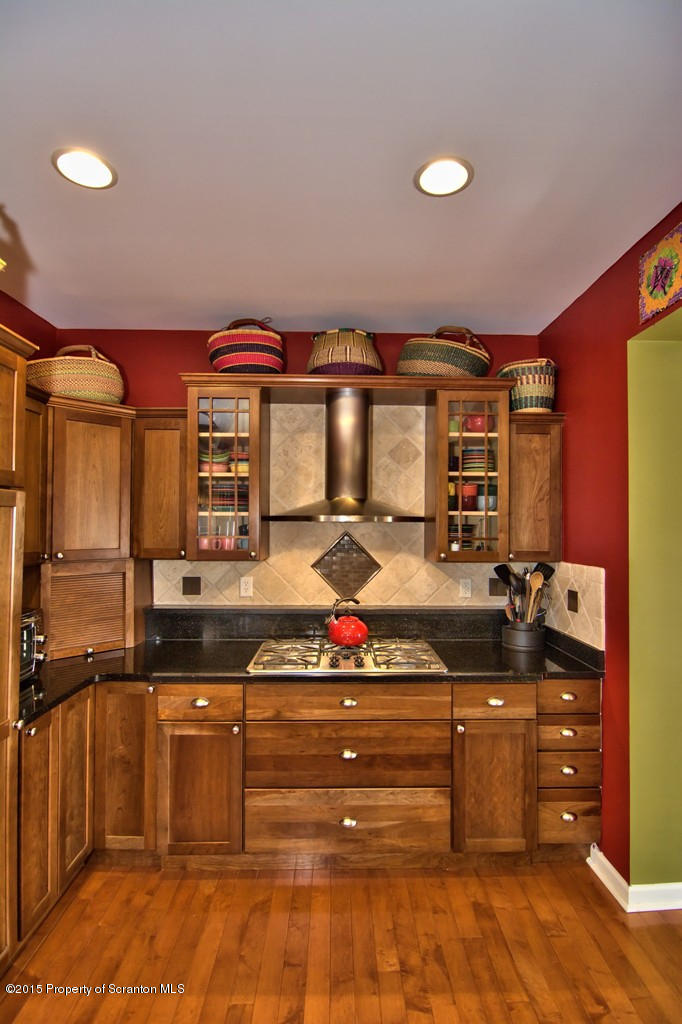1081 Motichka Road Moscow, PA 18444 - Photo 42 of 90 a kitchen with stainless steel appliances granite countertop a stove and a sink
