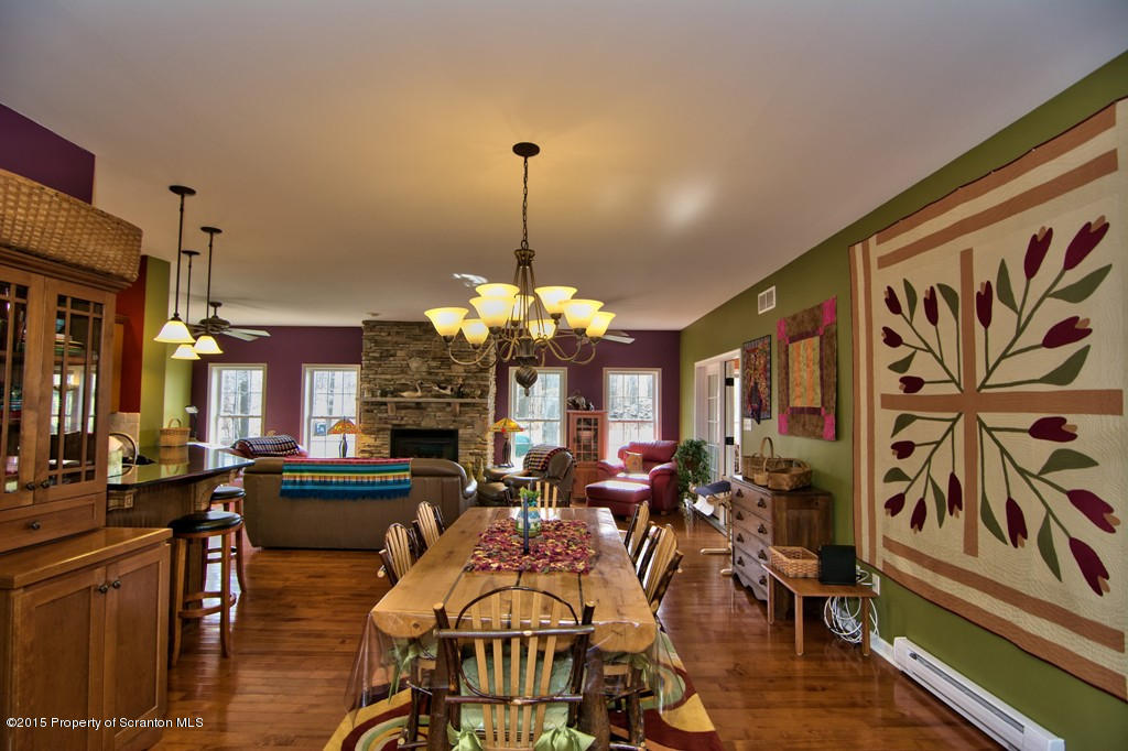1081 Motichka Road Moscow, PA 18444 - Photo 44 of 90 a view of a dining room with furniture and chandelier