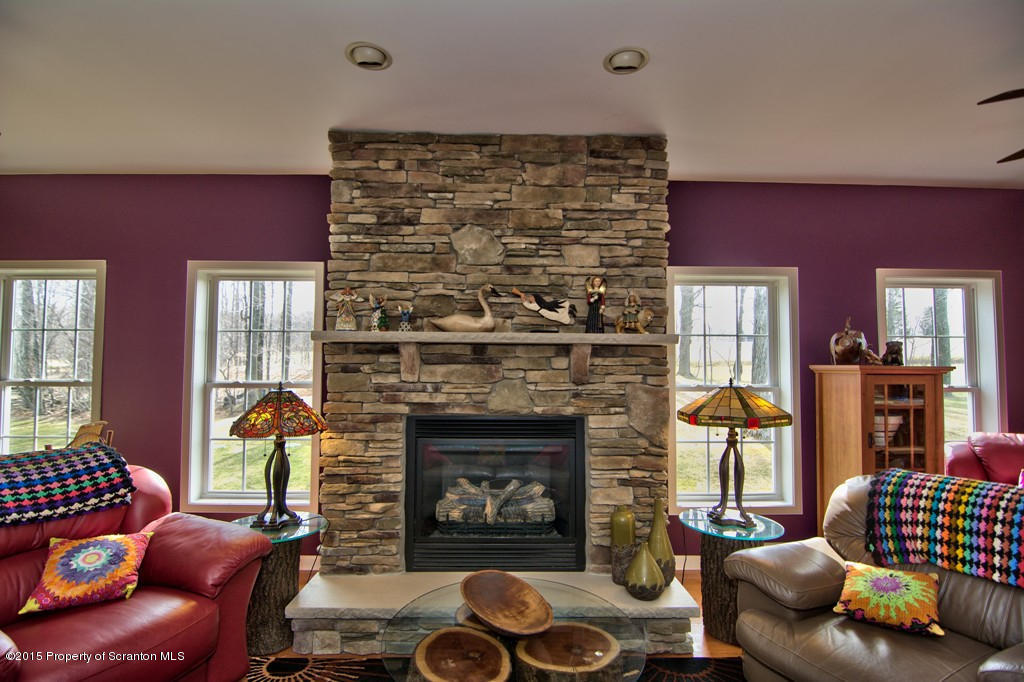 1081 Motichka Road Moscow, PA 18444 - Photo 53 of 90 a living room with furniture and a fireplace