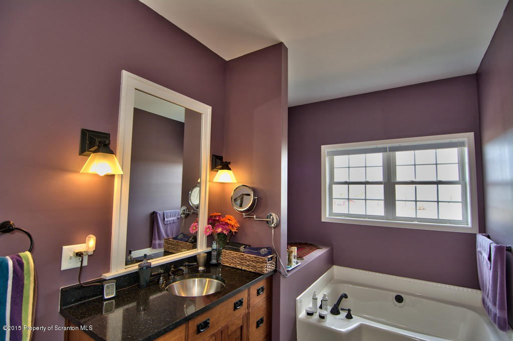 1081 Motichka Road Moscow, PA 18444 - Photo 62 of 90 a bathroom with a sink vanity tub and a mirror