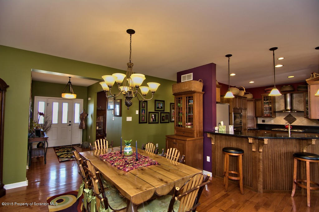 1081 Motichka Road Moscow, PA 18444 - Photo 63 of 90 a view of a dining room with furniture and a chandelier