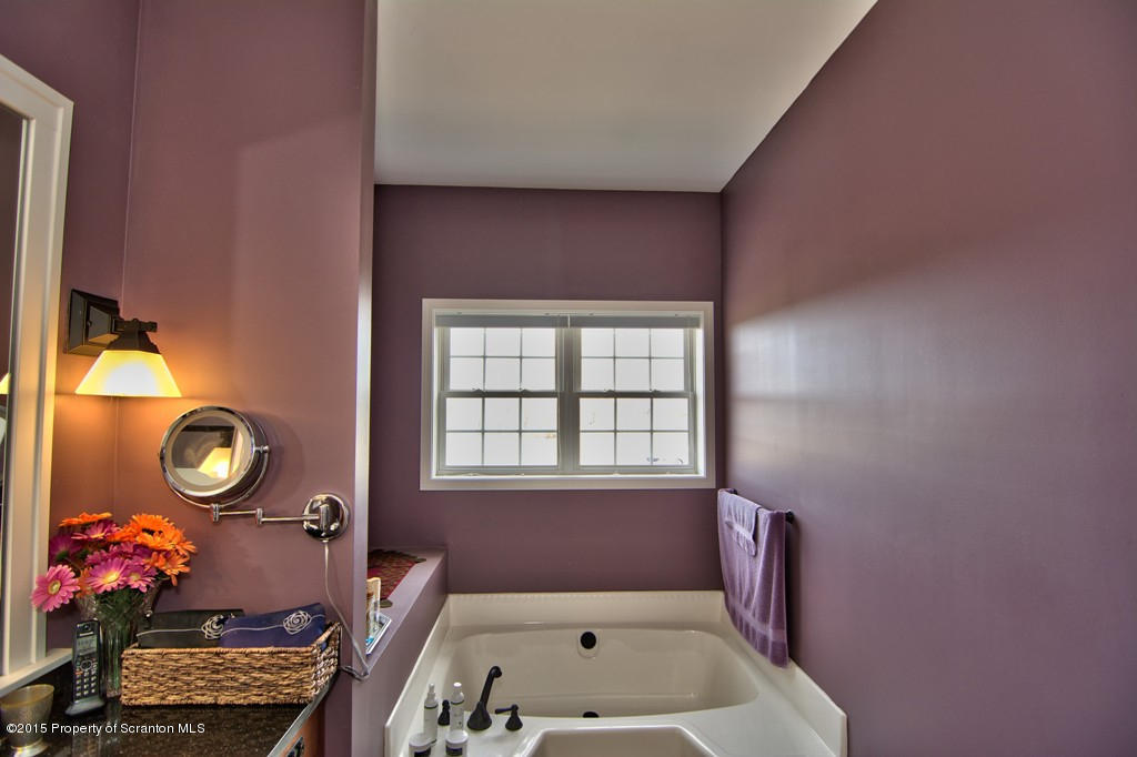 1081 Motichka Road Moscow, PA 18444 - Photo 64 of 90 a bathroom with a tub sink and view of living room