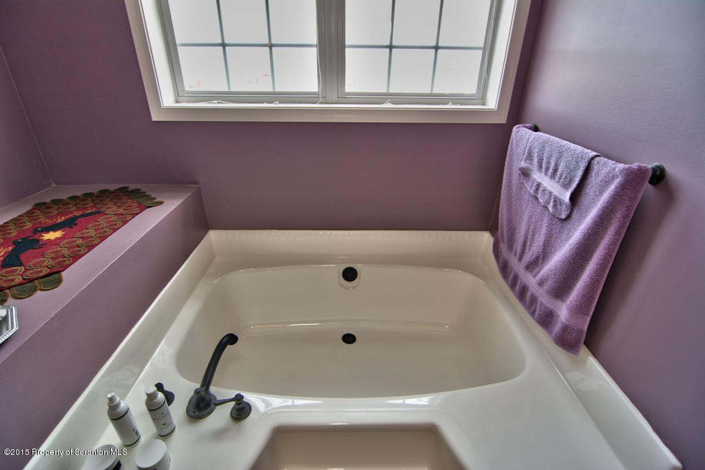 1081 Motichka Road Moscow, PA 18444 - Photo 65 of 90 a bathroom with a bathtub