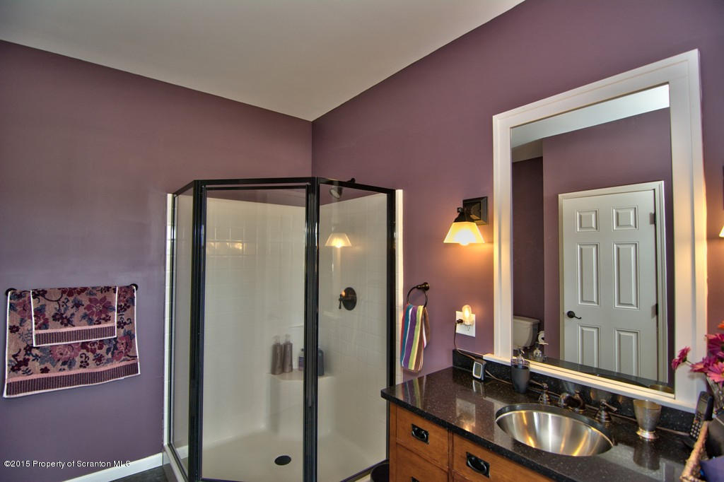 1081 Motichka Road Moscow, PA 18444 - Photo 67 of 90 a bathroom with a double vanity sink and a mirror