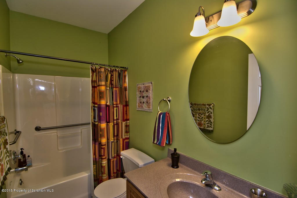 1081 Motichka Road Moscow, PA 18444 - Photo 77 of 90 a bathroom with a sink mirror and toilet