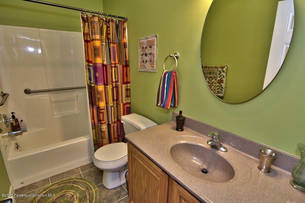 1081 Motichka Road Moscow, PA 18444 - Photo 78 of 90 a bathroom with a sink toilet and a mirror