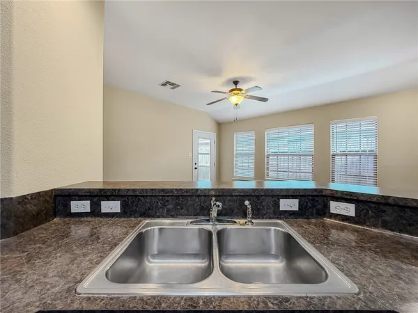 a close view of a sink a counter space and a sink