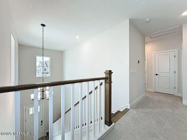 a view of a hallway with windows