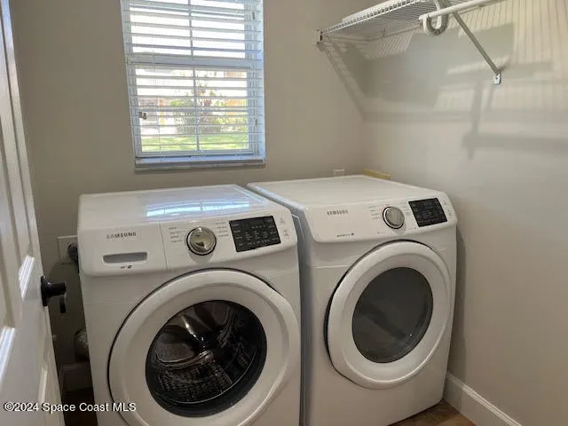 a utility room with dryer and washer