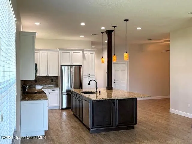 a kitchen with counter top space cabinets and stainless steel appliances