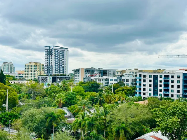a kitchen with stainless steel appliances a refrigerator and a stove top oven