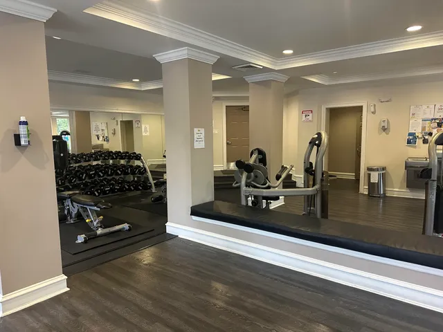 a living room with patio furniture and a flat screen tv