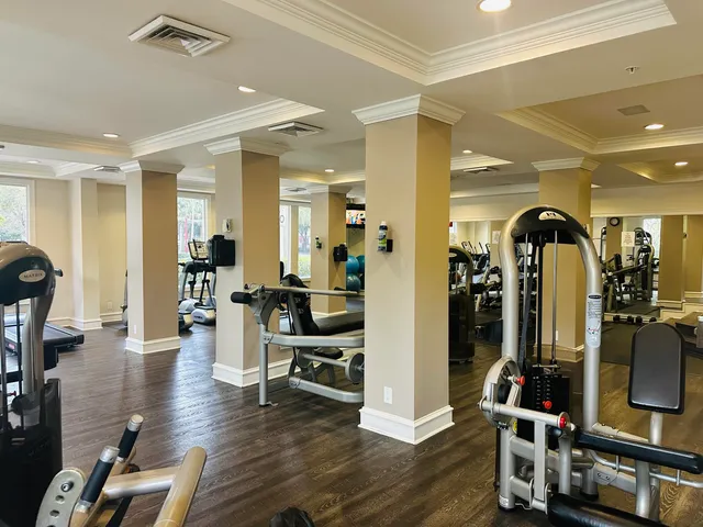 a living room with furniture a rug and a flat screen tv
