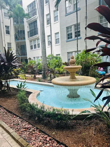 a sign that is on a brick wall