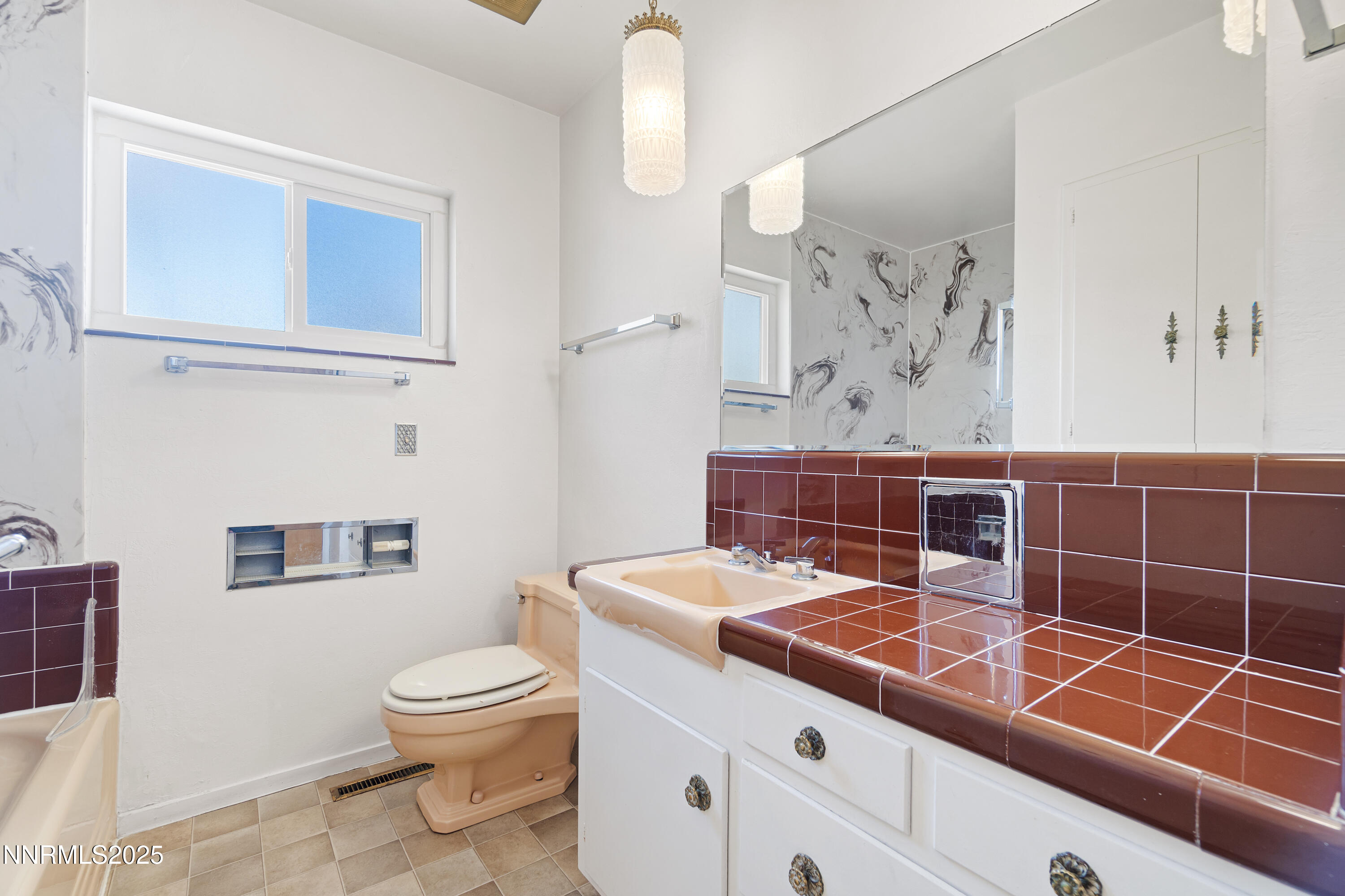 475 South Bailey Street Fallon, NV 89406 - Photo 16 of 27 a bathroom with a sink a toilet and shower curtain