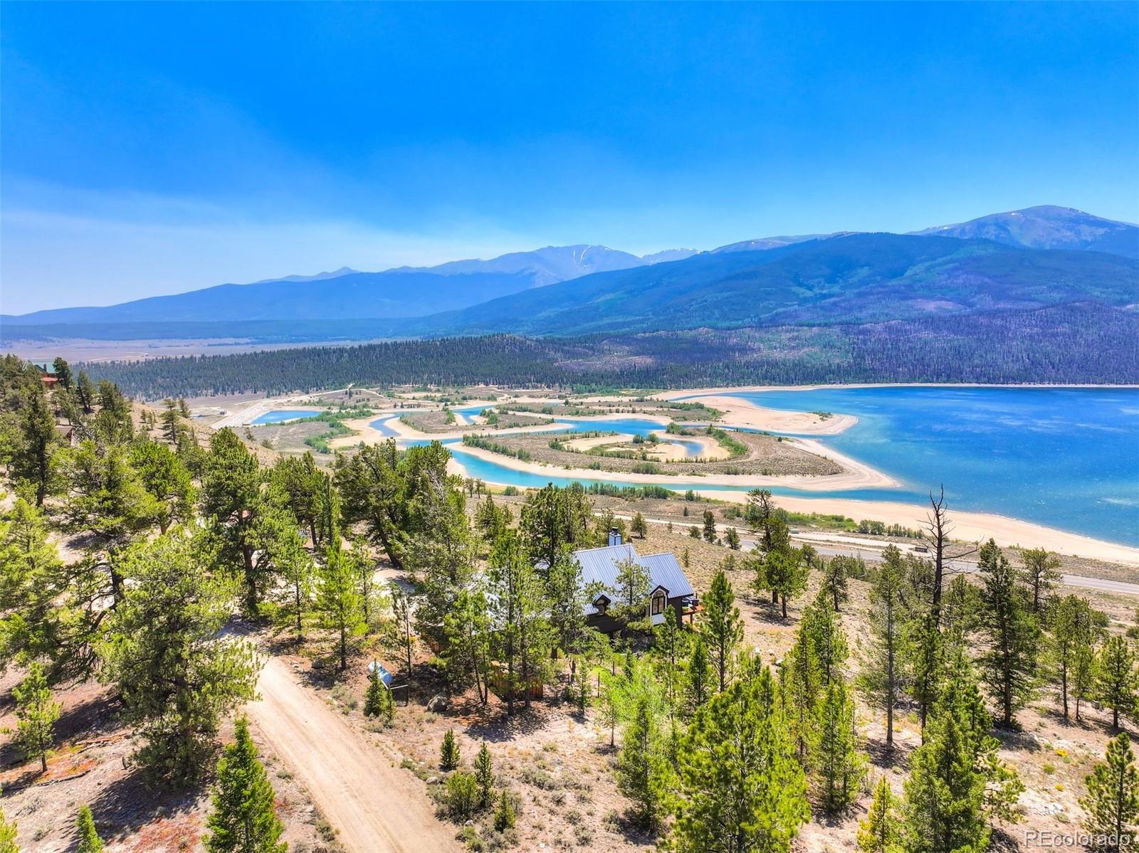 630 Reva Ridge Road Twin Lakes, CO 81251 - Photo 36 of 40 a view of a lake with a sunset
