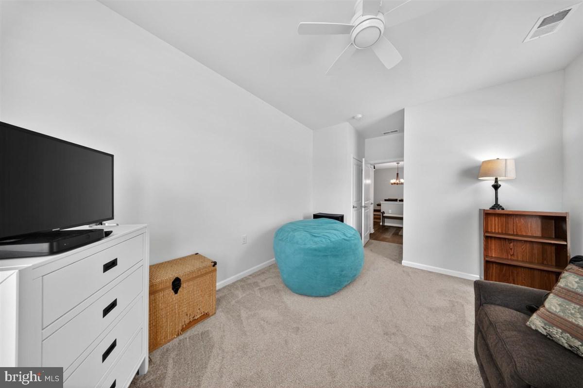 1426 Whispering Woods Road Middletown, DE 19709 - Photo 23 of 37 a room with furniture and a flat screen tv