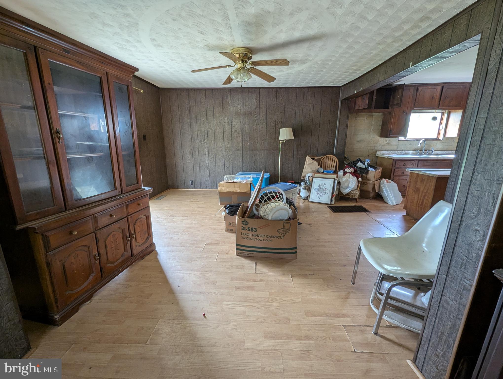 24001 Perry Hill Road Barton, MD 21521 - Photo 26 of 37 a living room with furniture and a flat screen tv