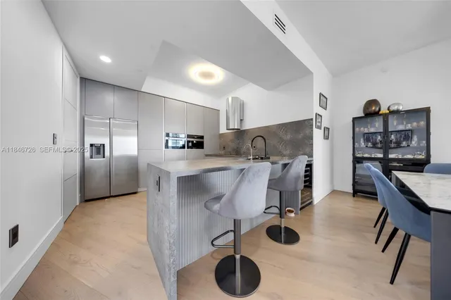 a living room with fireplace furniture and a chandelier