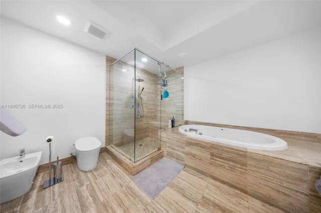 a bathroom with a shower and a toilet