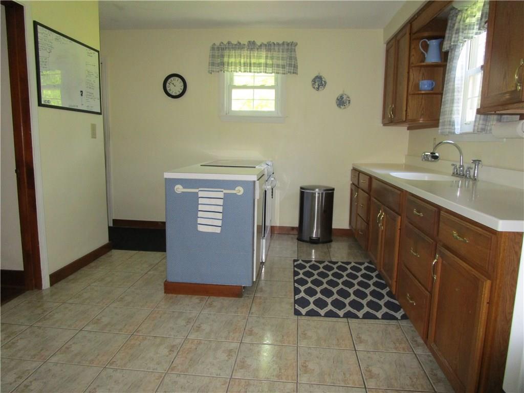 941 Youngstown Ridge Road Latrobe, PA 15650 - Photo 8 of 20 Kitchen with corian countertop and center island.